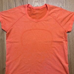 Lululemon Swiftly Tech  Bright Orange Short Sleeve Tee size 12 waistline